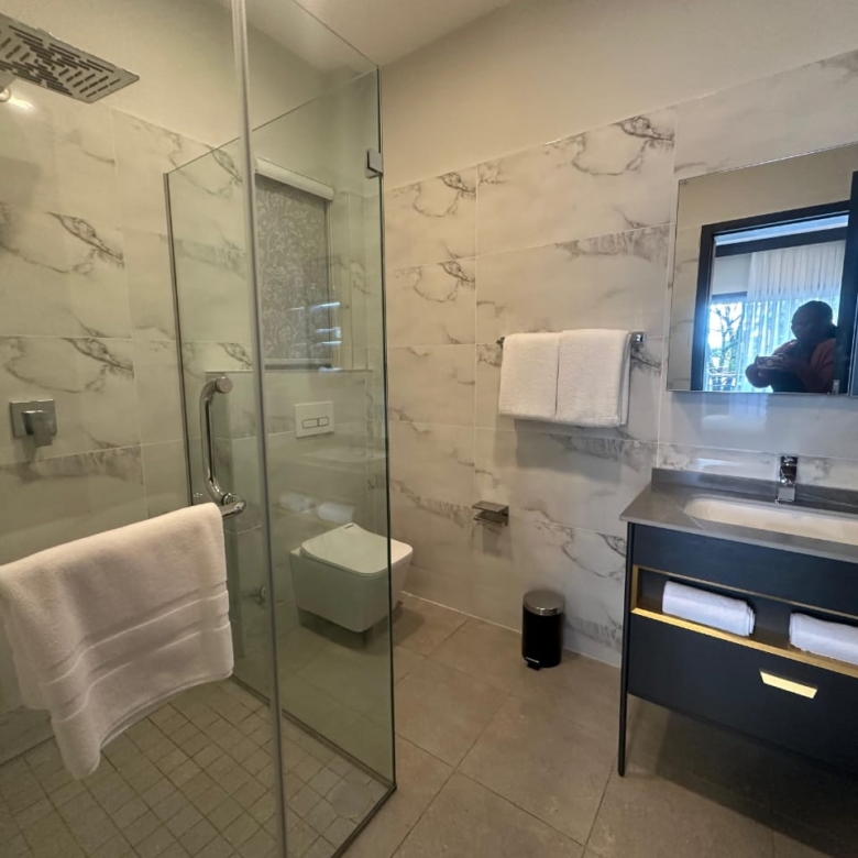 Bedroom with balcony access at Pearl Rivers Riverside Nairobi