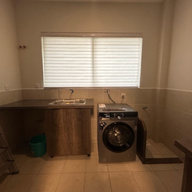 Utility and laundry area at Pearl Rivers Riverside apartment