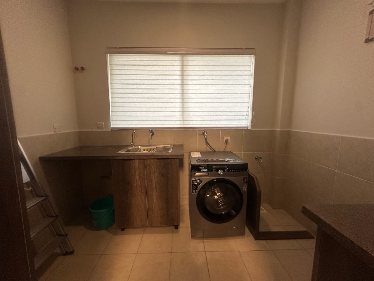 Utility and laundry area at Pearl Rivers Riverside apartment