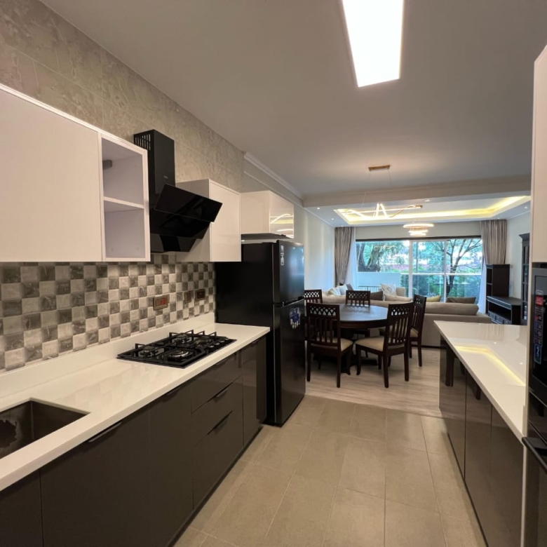 Modern fitted kitchen at Pearl Rivers Riverside apartment