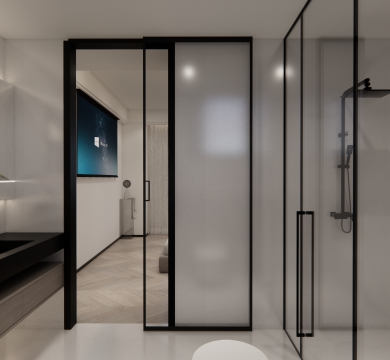 Skyline Apartments luxury ensuite bathroom with glass shower enclosure, floating vanity, illuminated mirror, and modern black fixtures.