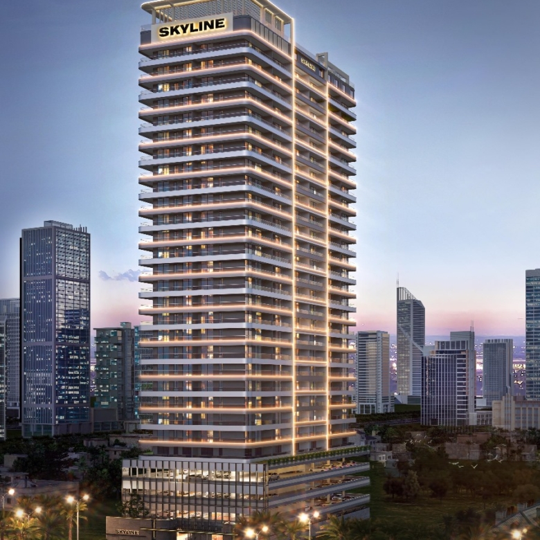 Skyline Apartments luxury high-rise residential tower with illuminated balconies and modern architecture against the evening skyline.