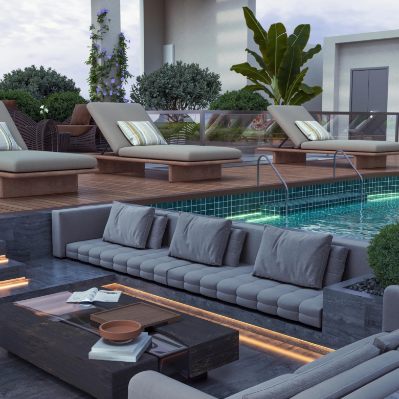 Skyline Apartments luxury poolside lounge with cushioned outdoor sofas, sun loungers, landscaped greenery, and swimming pool.