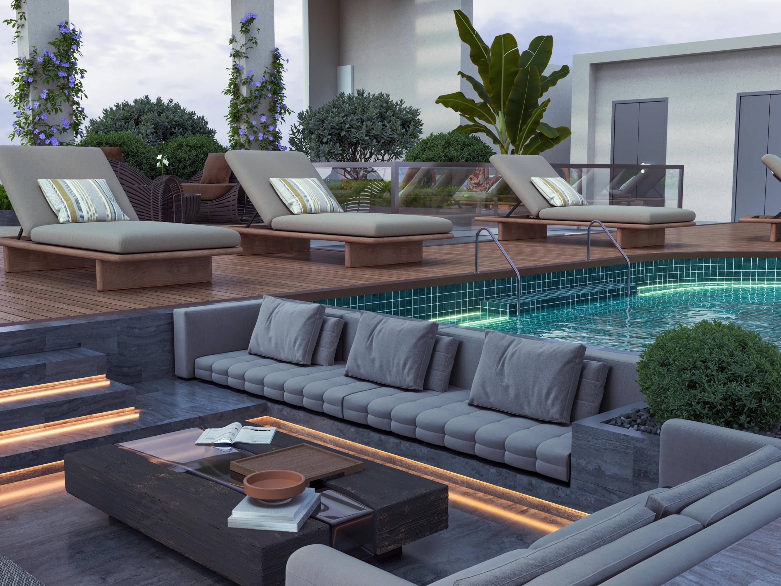 Skyline Apartments luxury poolside lounge with cushioned outdoor sofas, sun loungers, landscaped greenery, and swimming pool.