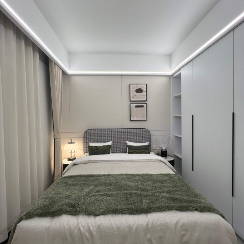 Luxury master bedroom at Ten50 Residences with built-in wardrobes and LED lighting.