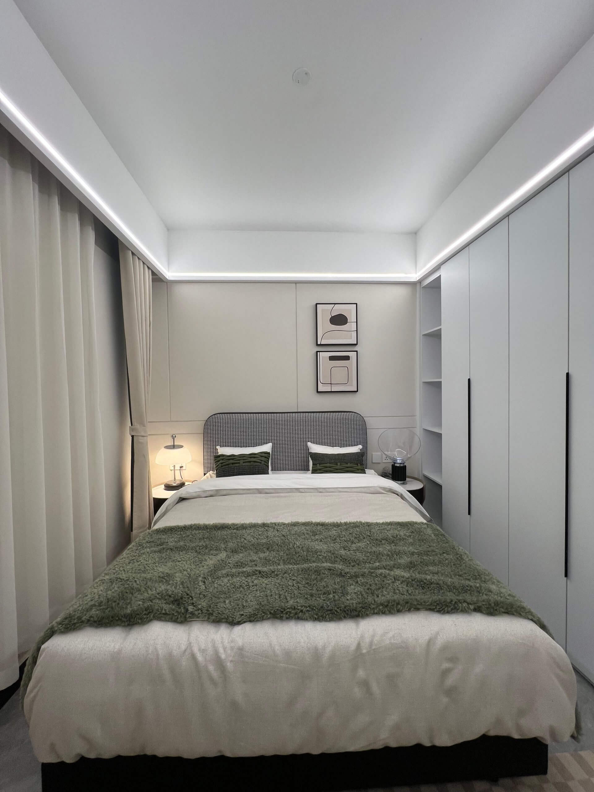 Luxury master bedroom at Ten50 Residences with built-in wardrobes and LED lighting.