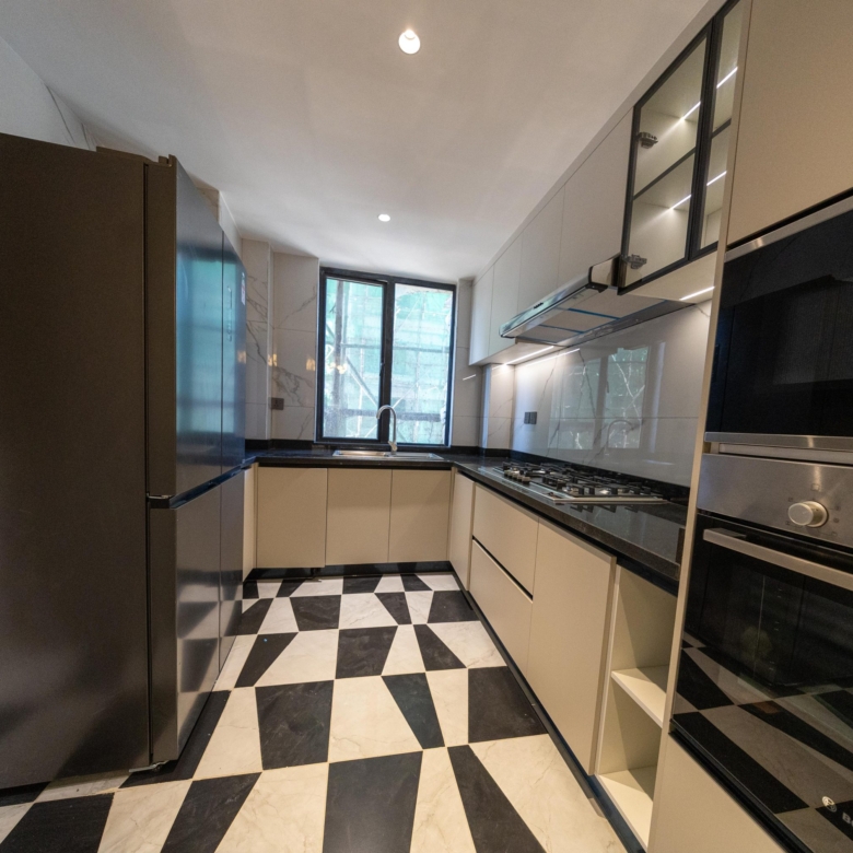 Closed fitted kitchen with built-in appliances at Himalaya Horizon Westlands