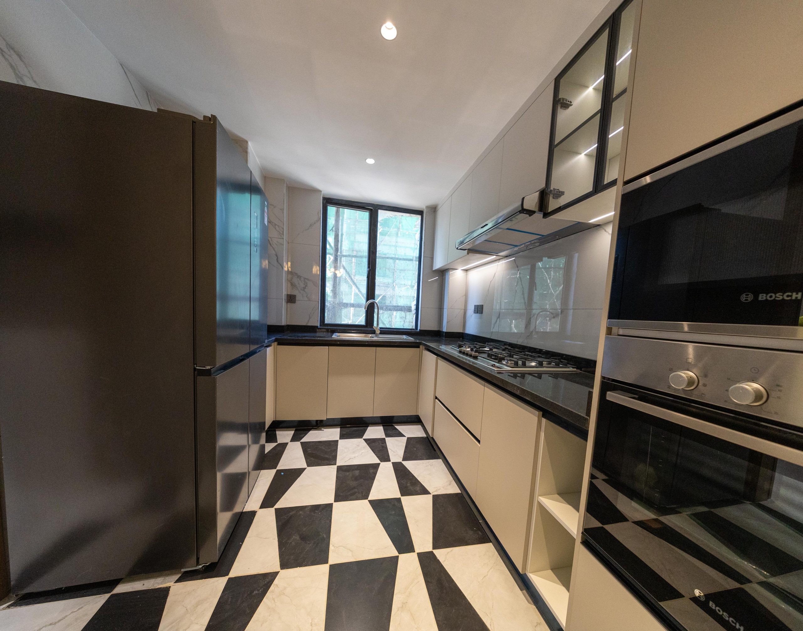 Closed fitted kitchen with built-in appliances at Himalaya Horizon Westlands