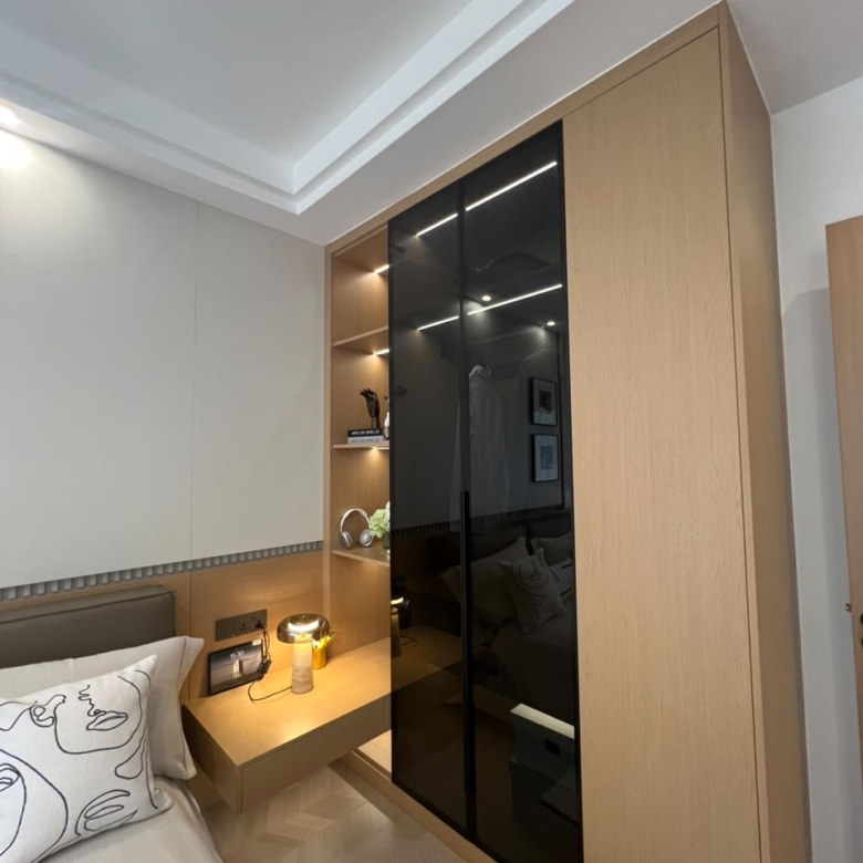 Diplomat Residences on Peponi Road Westlands Nairobi bedroom wardrobe with modern wood finish and black glass panels