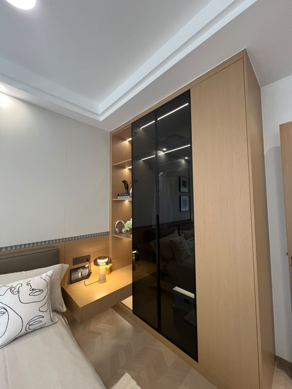 Diplomat Residences on Peponi Road Westlands Nairobi bedroom wardrobe with modern wood finish and black glass panels