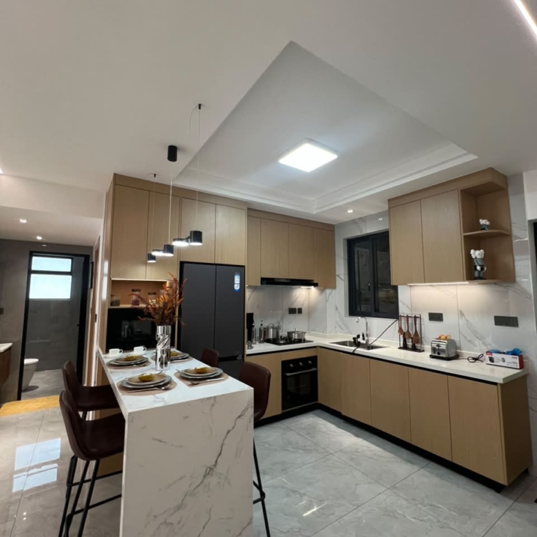 Diplomat Residences on Peponi Road Westlands Nairobi modern kitchen with island, fitted cabinets and marble countertops