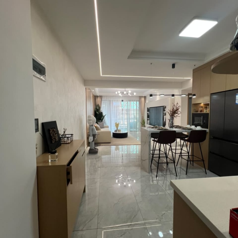 Diplomat Residences on Peponi Road Westlands Nairobi open plan living room and kitchen with modern island