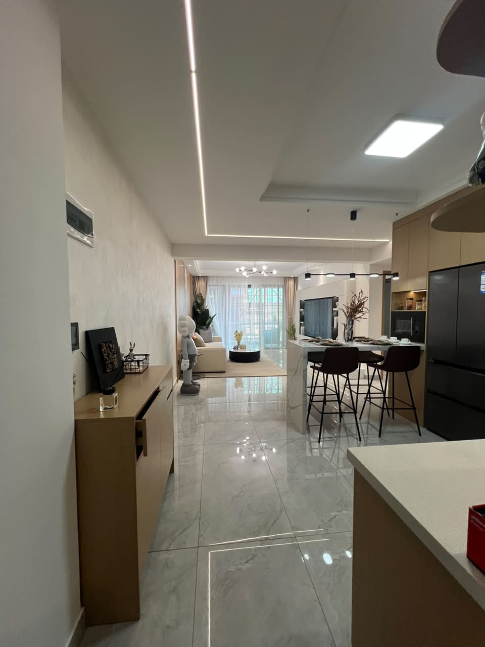 Diplomat Residences on Peponi Road Westlands Nairobi open plan living room and kitchen with modern island