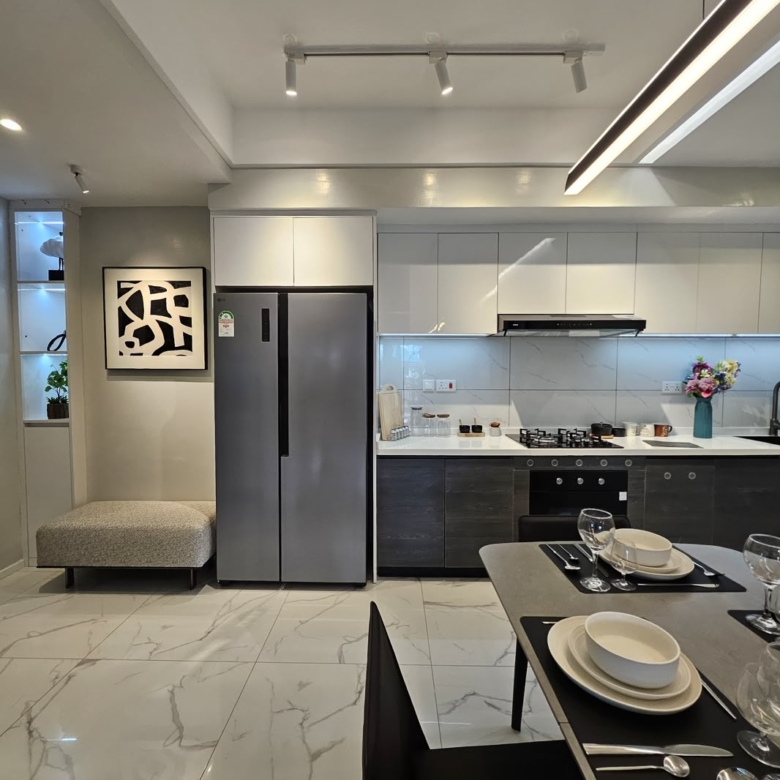 Modern fitted kitchen with appliances and dining area at ILU Green Homes Kilimani