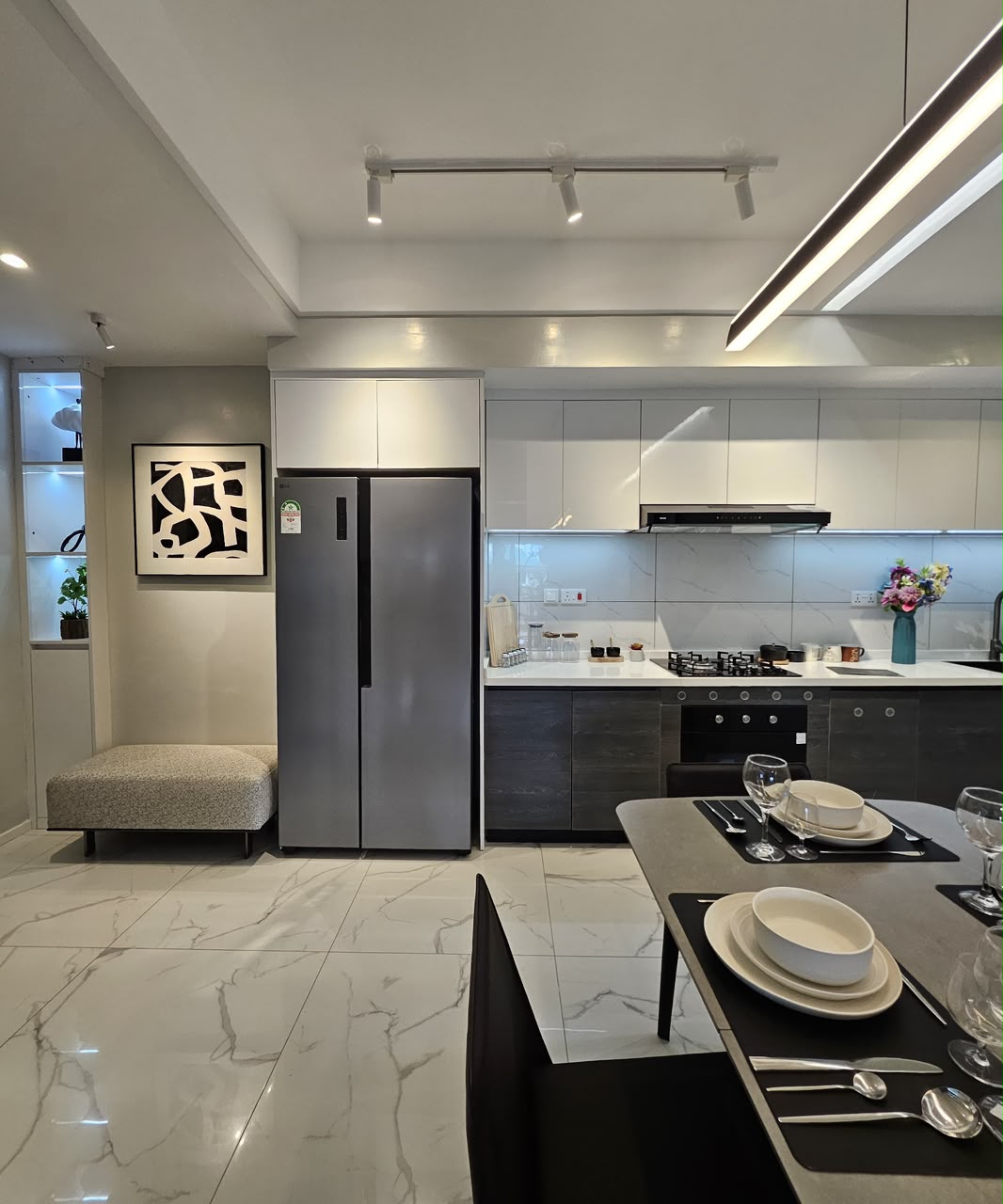 Modern fitted kitchen with appliances and dining area at ILU Green Homes Kilimani
