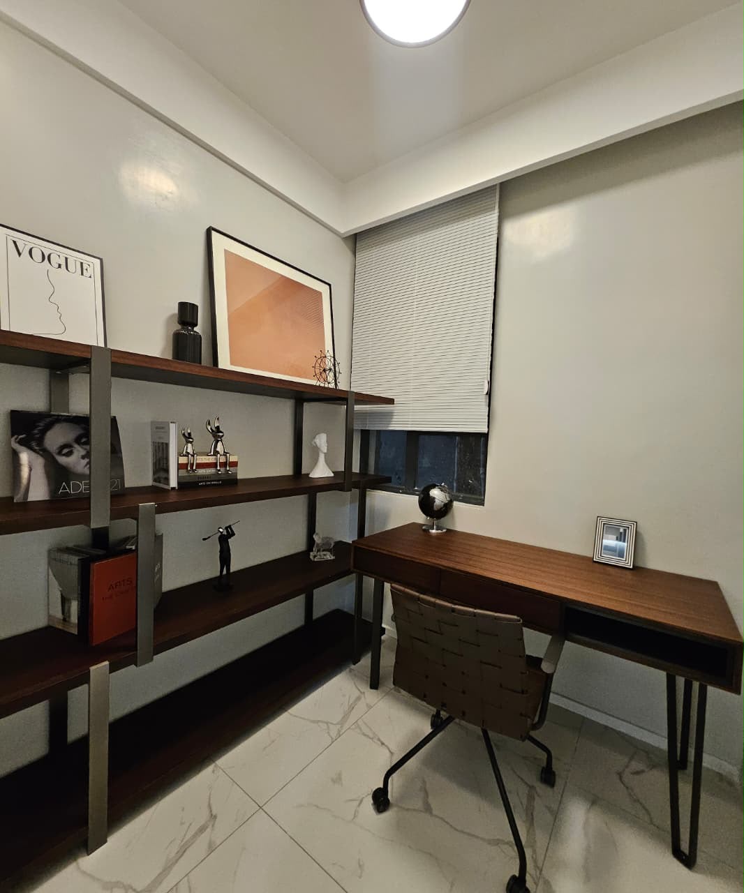Furnished home office with wooden desk and shelving at ILU Green Homes Kilimani