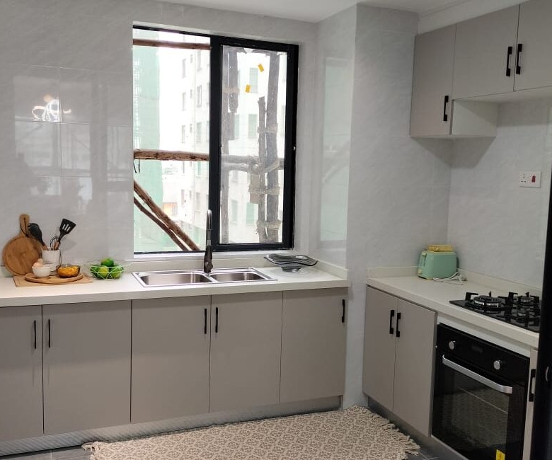 Fitted kitchen with built-in appliances at Himalaya Horizon apartments in Westlands