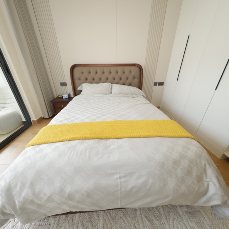 Modern show apartment bedroom with built-in wardrobes at Luster Arbor Residency