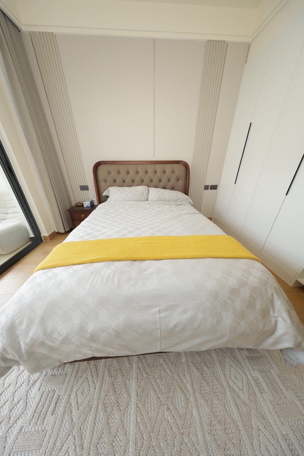 Modern show apartment bedroom with built-in wardrobes at Luster Arbor Residency