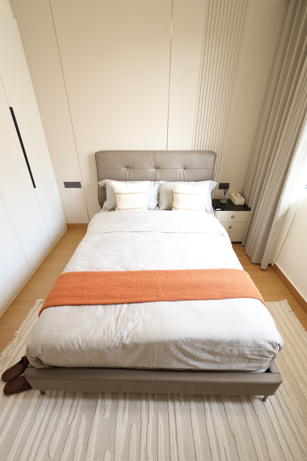 Bright furnished bedroom with fitted wardrobe in a Luster Arbor Residency apartment
