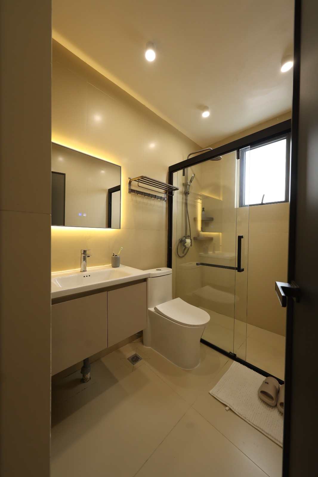 Interior corridor leading to a bedroom in a Luster Arbor Residency apartment