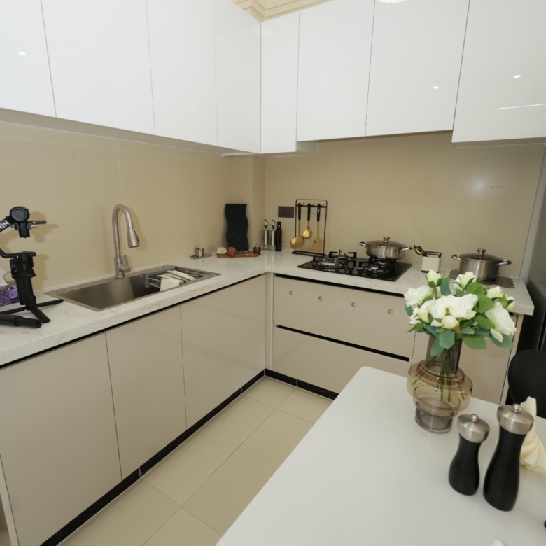 Modern fitted kitchen with white cabinets at Luster Arbor Residency, Kileleshwa