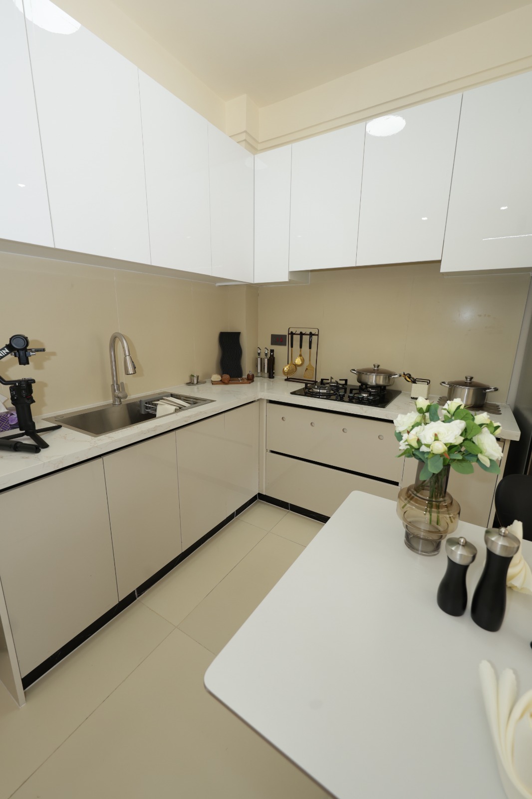 Modern fitted kitchen with white cabinets at Luster Arbor Residency, Kileleshwa