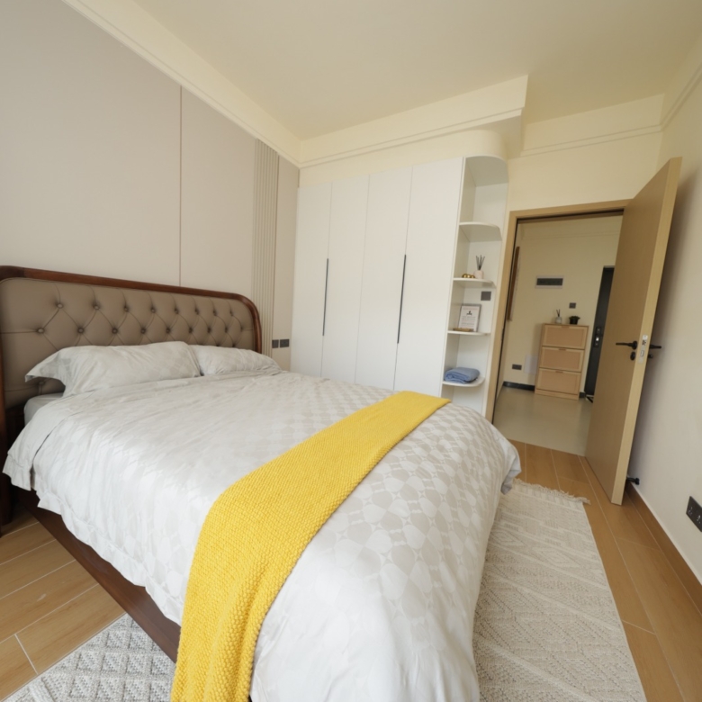 Furnished bedroom with fitted wardrobes in a Luster Arbor Residency show apartment