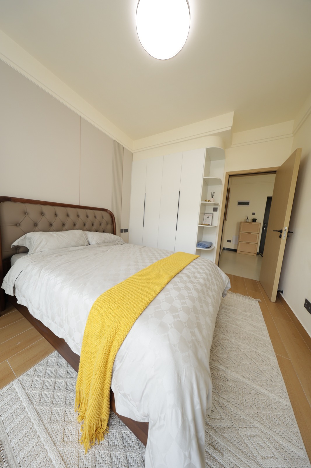 Furnished bedroom with fitted wardrobes in a Luster Arbor Residency show apartment