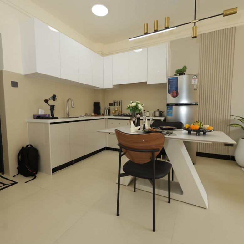 Spacious open-plan kitchen and dining space in a Luster Arbor Residency show apartment
