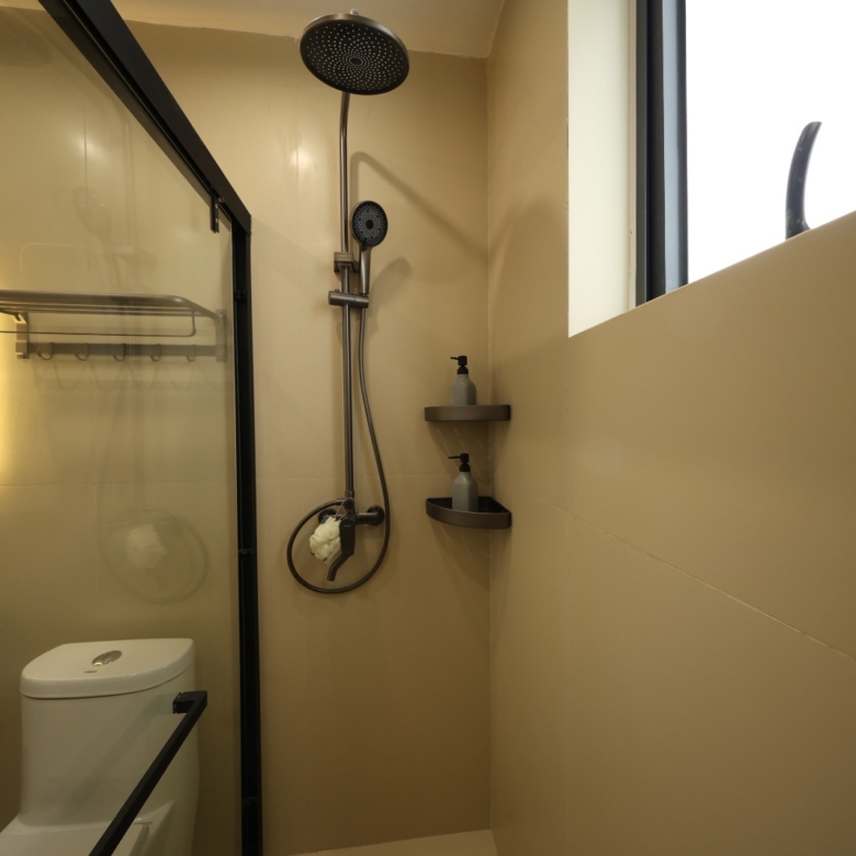 Modern ensuite bathroom with vanity and glass shower at Luster Arbor Residency