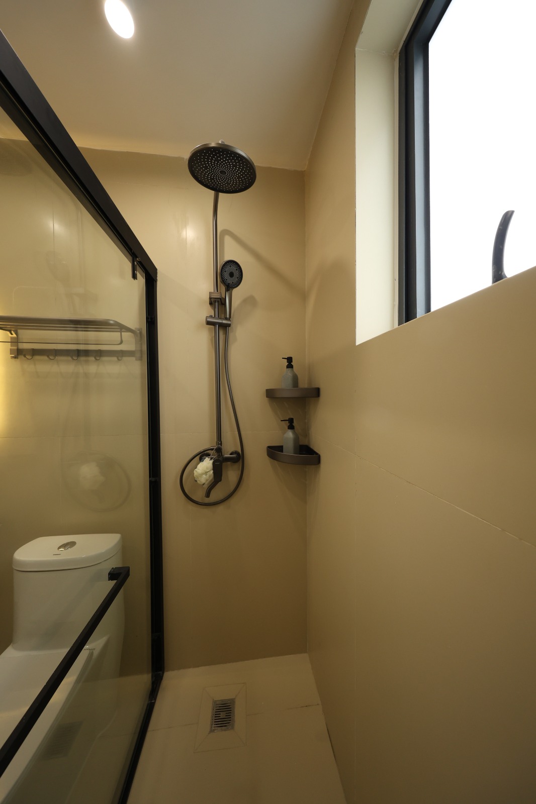 Modern ensuite bathroom with vanity and glass shower at Luster Arbor Residency