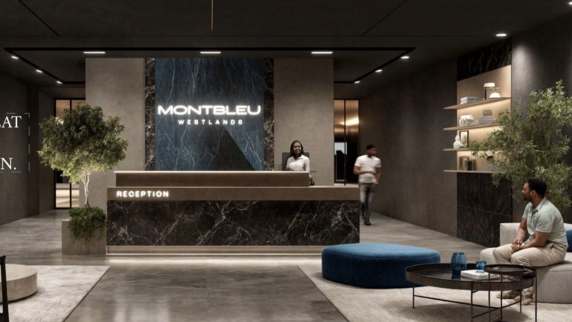 Montbleu apartments Westlands reception lobby rendering featuring a marble-finish reception desk, illuminated Montbleu signage, lounge seating, decorative plants, and modern lighting.