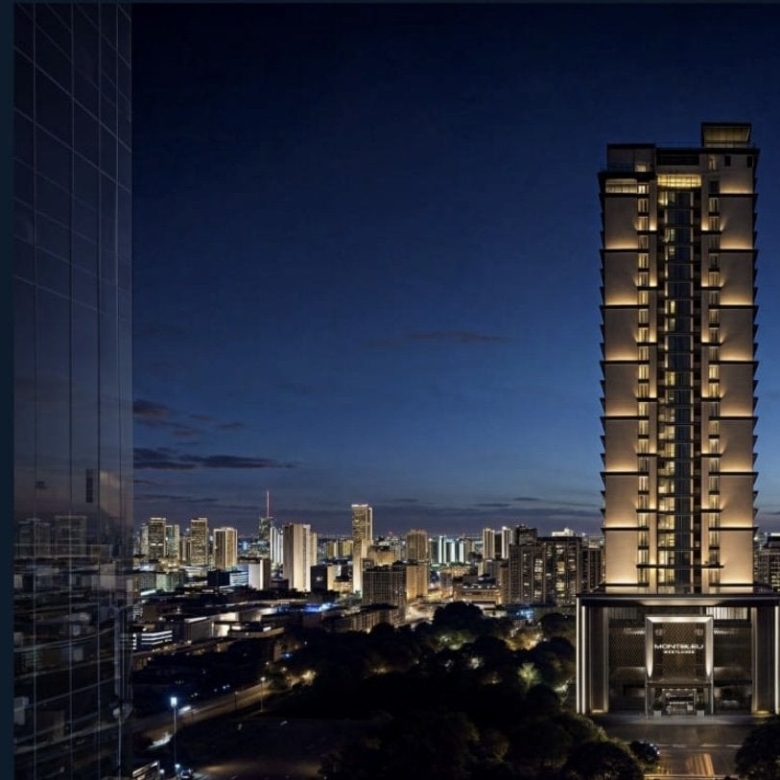 Montbleu apartments Westlands high-rise building exterior rendering at night, showing illuminated residential floors, modern balconies, glass façades, and the Nairobi skyline.