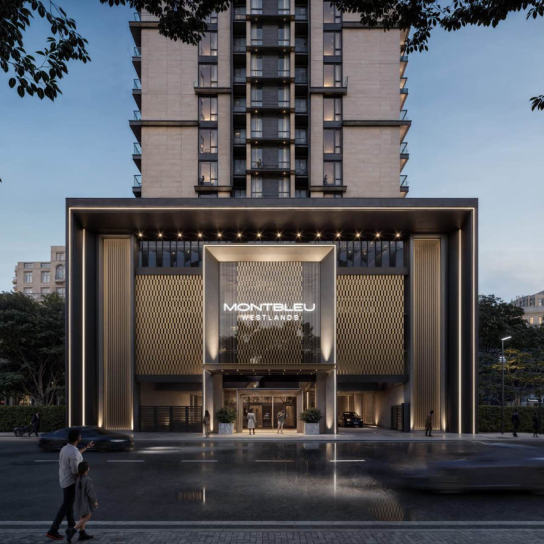 Montbleu apartments Westlands grand entrance rendering showing the modern residential tower, illuminated entrance canopy, decorative exterior panels, glass doors, and landscaped surroundings.