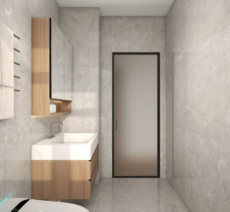 Riara One Residency modern bathroom with grey marble-look tiles, wooden vanity, white countertop basin, and towel rack.