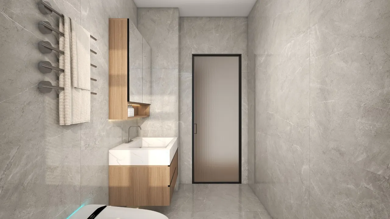 Riara One Residency modern bathroom with grey marble-look tiles, wooden vanity, white countertop basin, and towel rack.