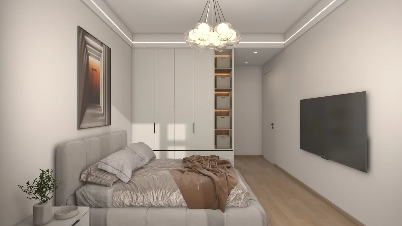 Riara One Residency bedroom with upholstered bed, fitted wardrobes, wall-mounted television, decorative chandelier, and wooden flooring.