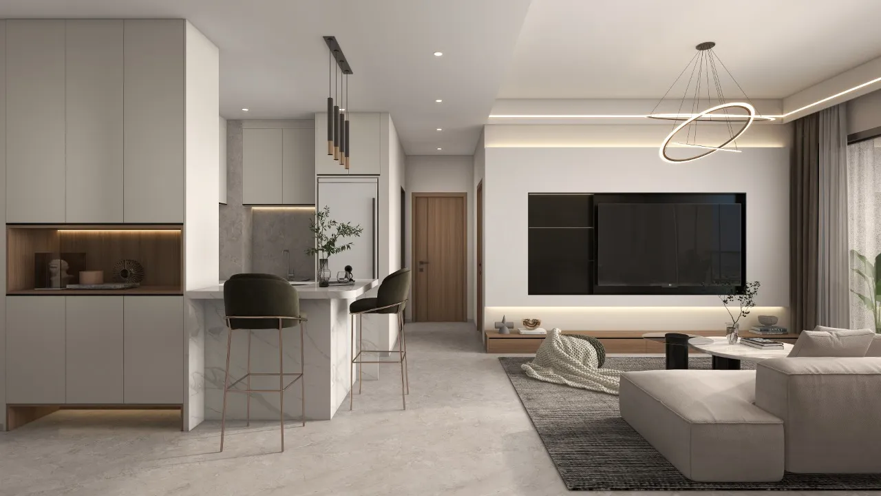 Riara One Residency open-plan living room with cream sectional sofa, breakfast counter, modern lighting, and fitted kitchen.