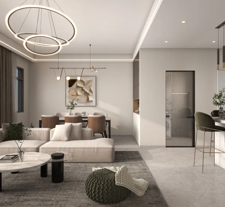 Riara One Residency luxury living room with sectional sofa, marble-look coffee table, circular chandelier, dining area, and balcony access.