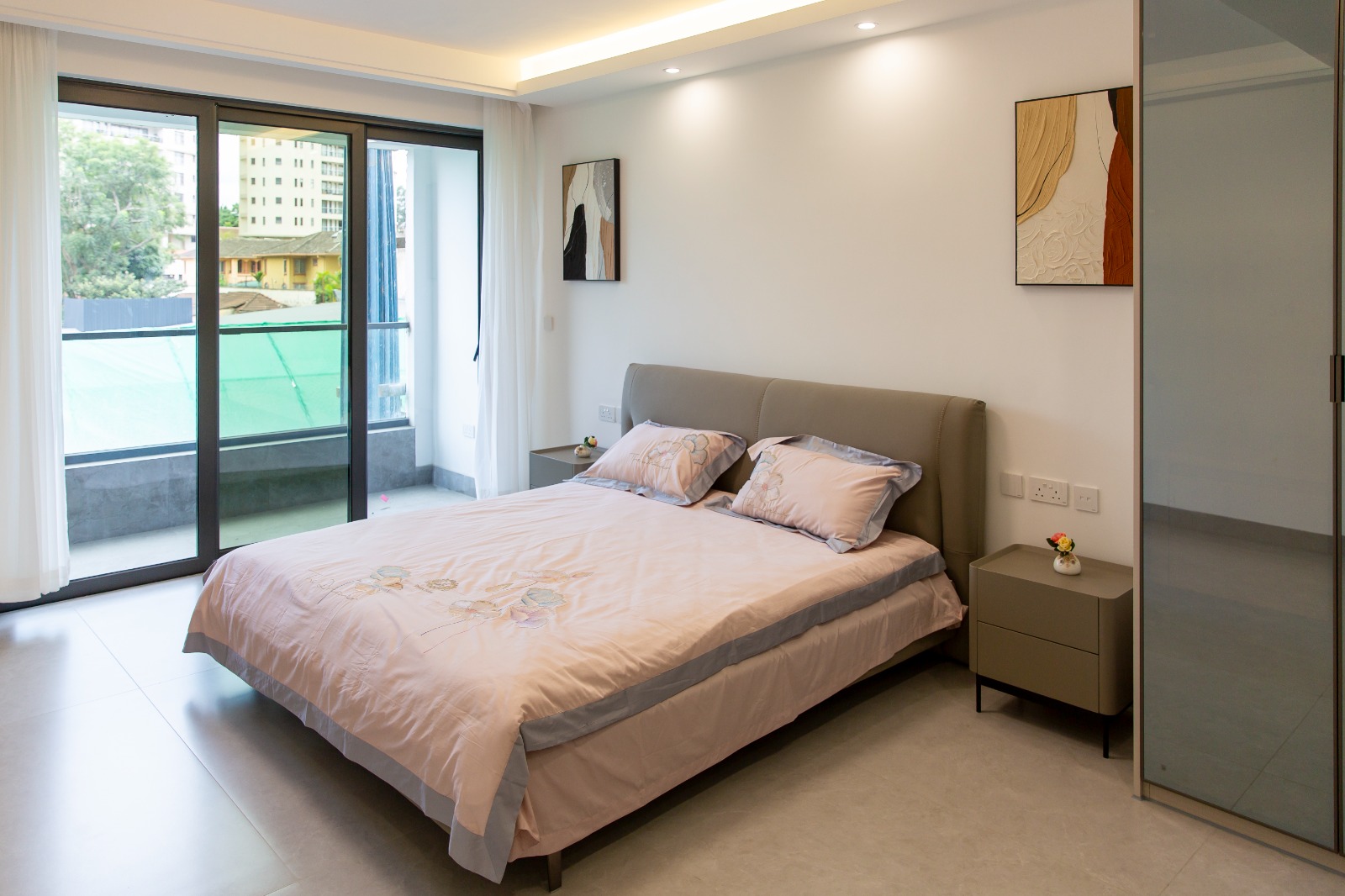 Spacious bedroom with private balcony at Sunset Park Apartments