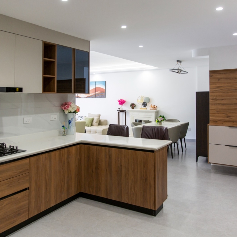 Modern kitchen opening to the dining and living area at Sunset Park