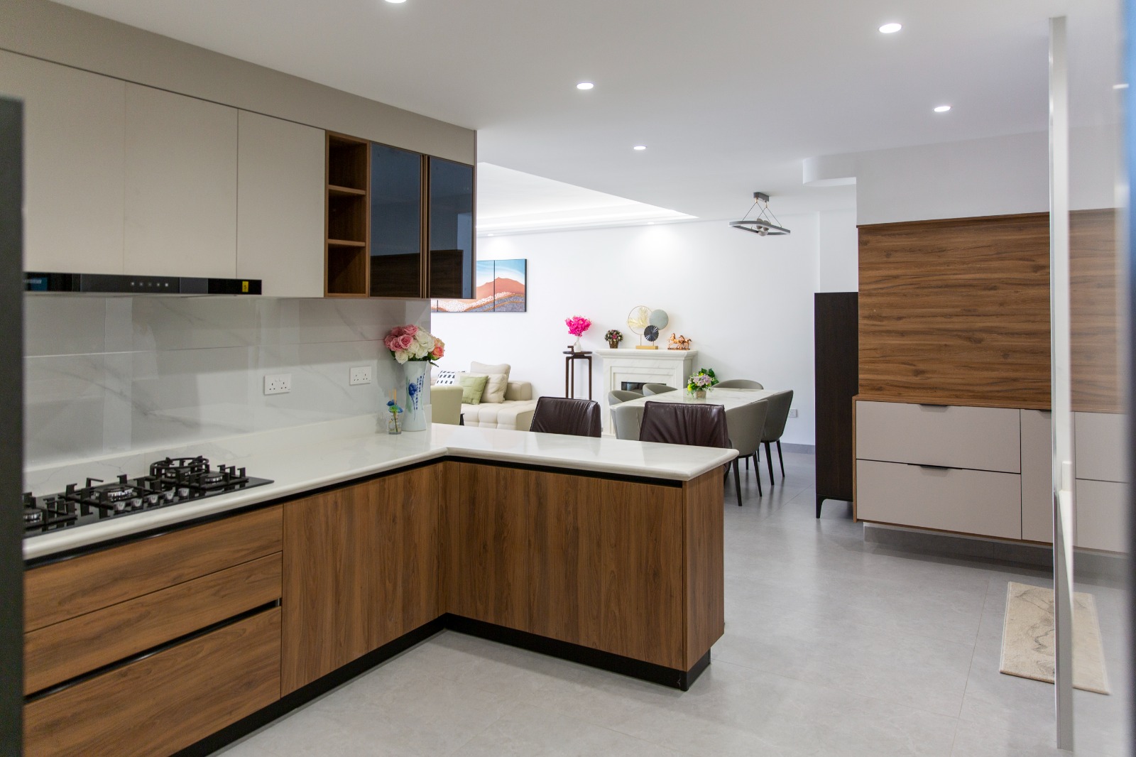 Modern kitchen opening to the dining and living area at Sunset Park