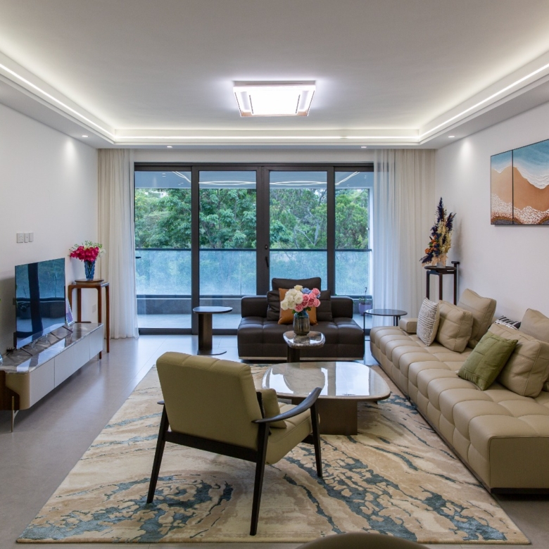 Spacious living room with balcony access at Sunset Park Apartments