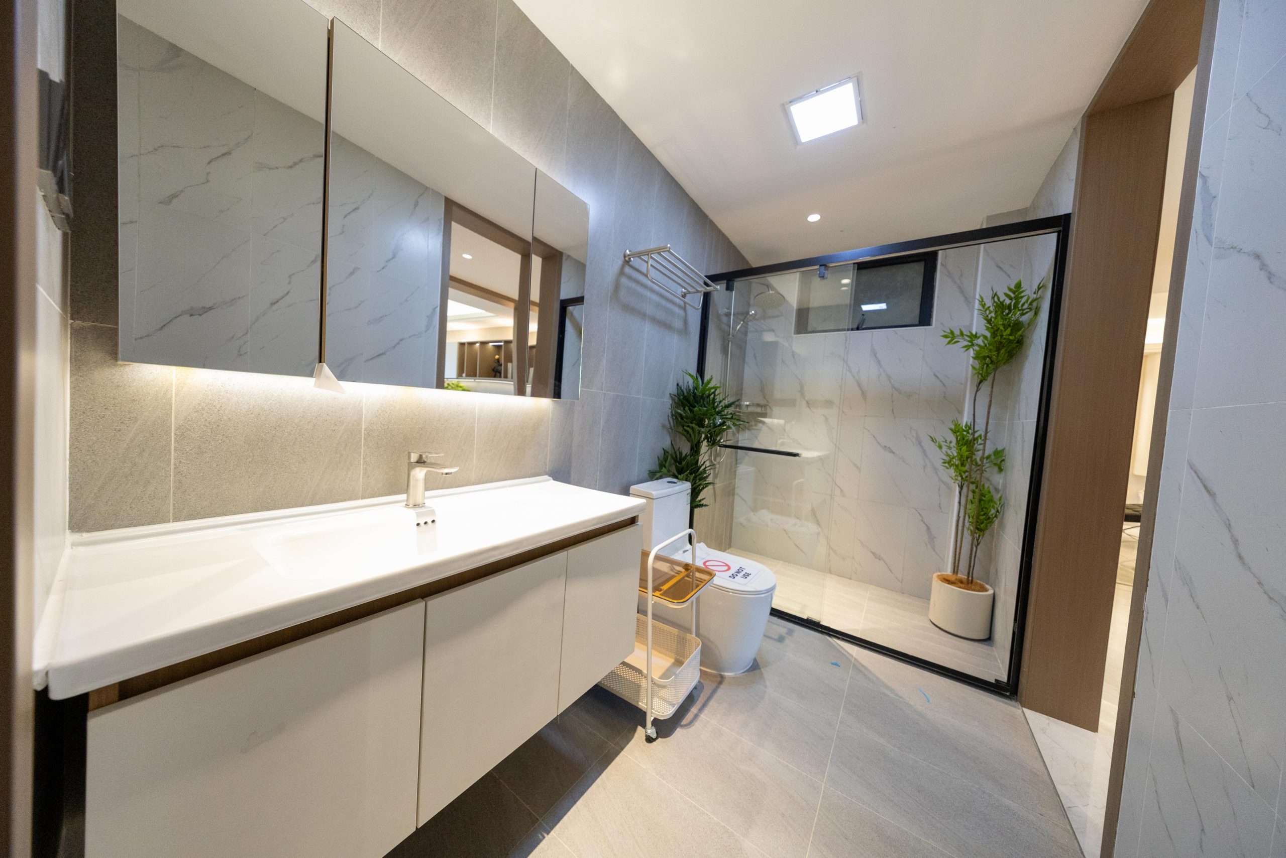 Modern bathroom with glass shower at Himalaya Horizon apartments in Westlands