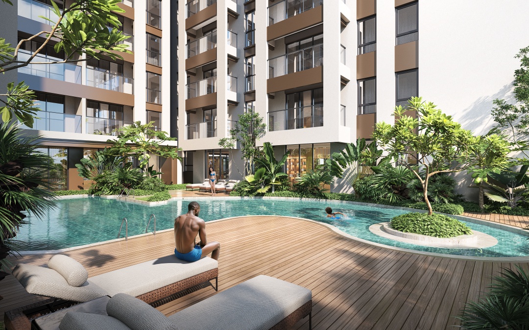 Lesonia Residence outdoor swimming pool with landscaped gardens, wooden pool deck, sun loungers, and surrounding apartment balconies.