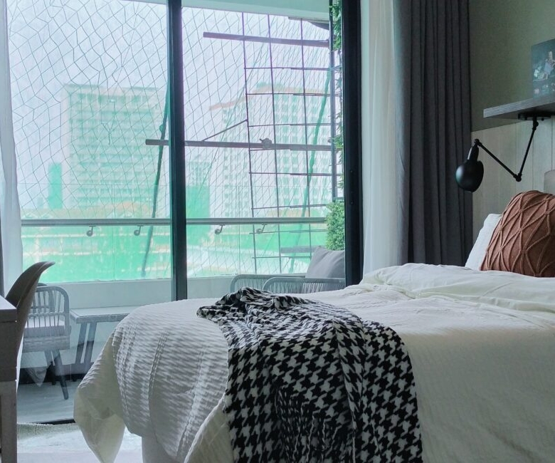 Citi Rise Residency in Westlands bedroom with large balcony doors, study desk and modern bed setup