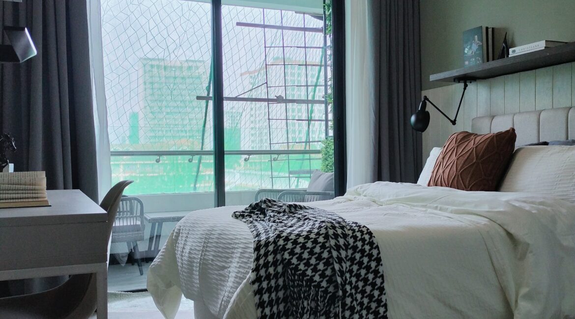 Citi Rise Residency in Westlands bedroom with large balcony doors, study desk and modern bed setup