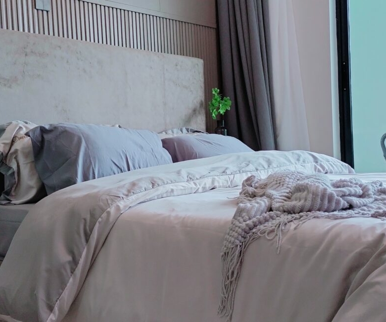 Citi Rise Residency in Westlands furnished bedroom with upholstered headboard, soft bedding and balcony access