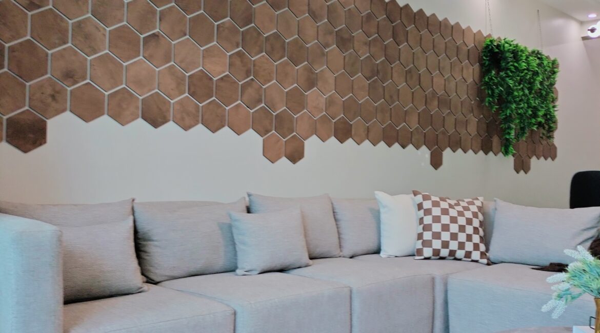 Citi Rise Residency in Westlands lounge with sofa, decorative wall panels and indoor greenery